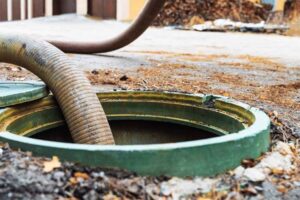 Pumping out sewage from a septic tank Owosso, MI