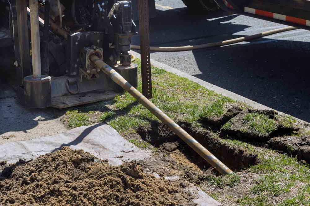 Sloan’s Septic technician working with trenchless equipment