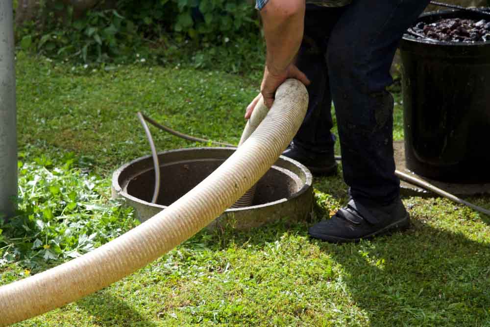 septic tank maintenance procedure underway